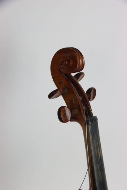 Study violin in its case. A bow is attached...