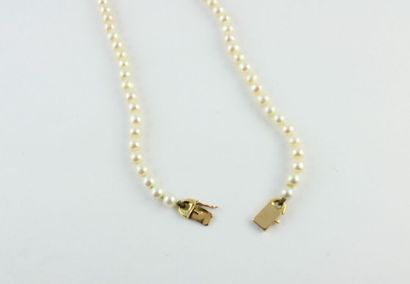 Necklace decorated with cultured pearl, the...