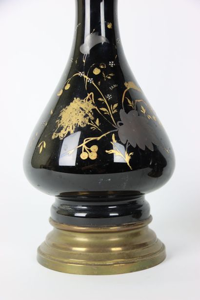 A pair of baluster oil lamps in porcelain...