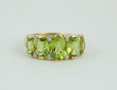 Bague jarretière en or jaune 18K (750/1000)...