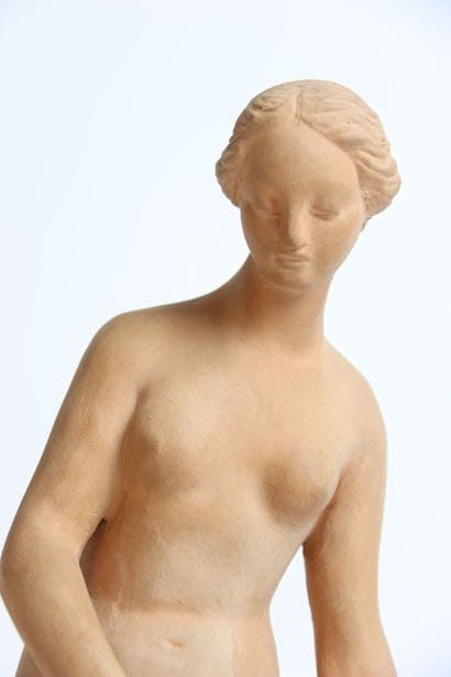 Large terracotta statue of a young woman...