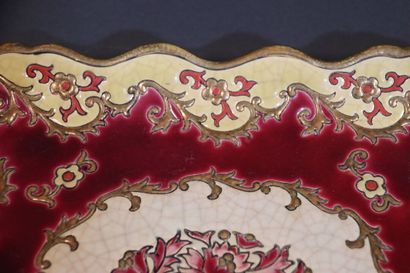 LONGWY. Dish in enamelled and cracked earthenware...