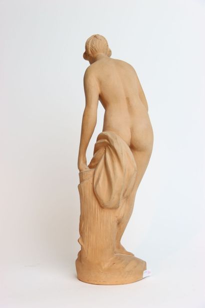 Large terracotta statue of a young woman...