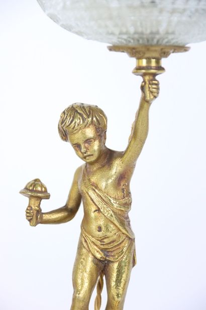 Pair of gilt bronze lamps, the shaft formed...