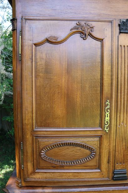 Buffet in molded and carved oak opening by...