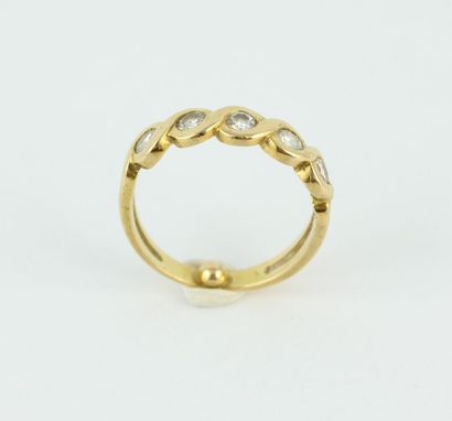 Bague en or jaune 18K (750/1000) ornée de...