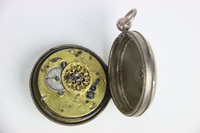 Pocket watch and silver case. Arabic numerals....