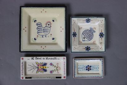 Four small plates of which one representing...