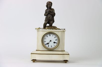 Marble clock surmounted by a sculpture of...