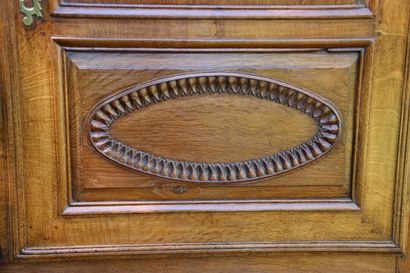 Buffet in molded and carved oak opening by...