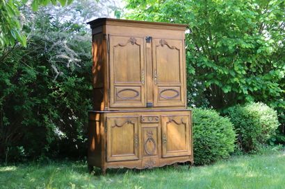 Buffet in molded and carved oak opening by...