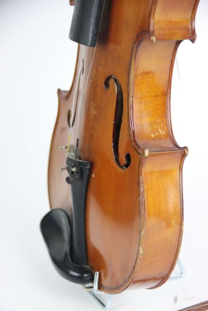 Study violin in its case. A bow is attached...
