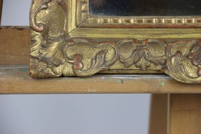 Carved and gilded wood mirror with foliage...