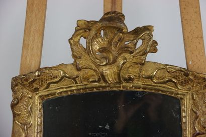 Carved and gilded wood mirror, pediment with...