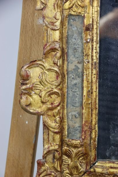 Carved and gilded wood mirror with openwork...