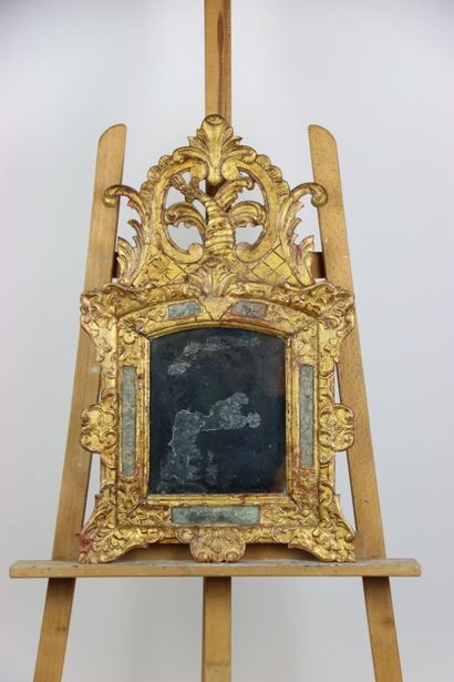Carved and gilded wood mirror with openwork...