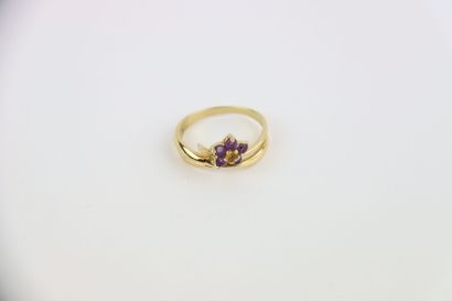 1 gold cross pendant, 1 gold and violet stone...