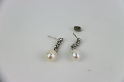 1 pair of silver studs set with white pearl...