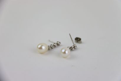 1 pair of silver studs set with white pearl...