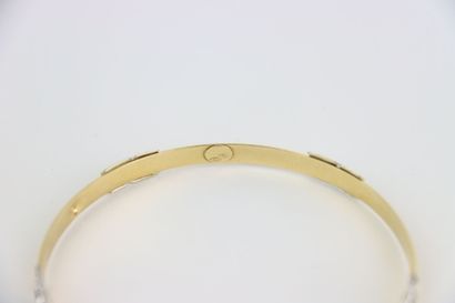 1 rigid gold bracelet, engraved decoration....