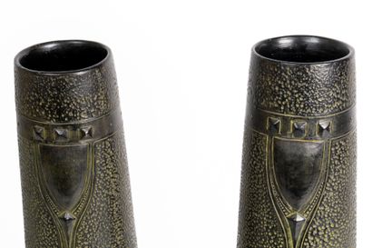 Pair of vases in glazed terra cotta. 
Geometric...