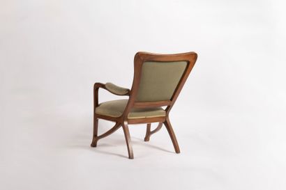 Louis MAJORELLE (1859-1926).
Light wood armchair...