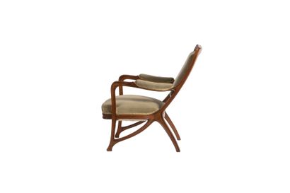 Louis MAJORELLE (1859-1926).
Light wood armchair...