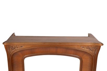 Mantel surround in mahogany and carved mahogany...
