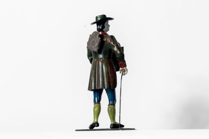 Pendule en métal polychrome figurant un homme...