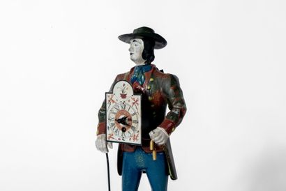 Pendule en métal polychrome figurant un homme...