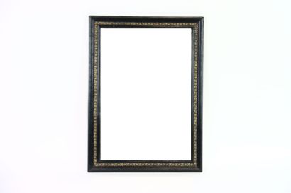 Miroir en bois sculpté à décor de tiges,...