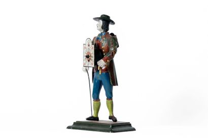 Pendule en métal polychrome figurant un homme...