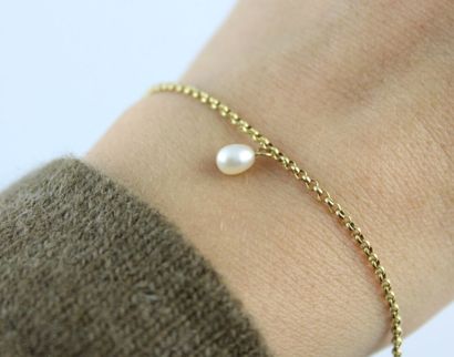Bracelet en or jaune 18K (750/1000) mailles...