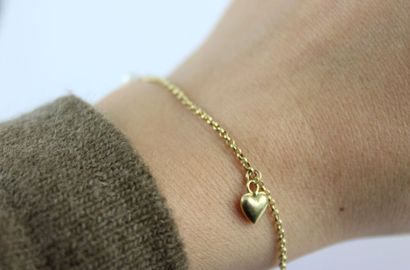 Bracelet en or jaune 18K (750/1000) mailles...