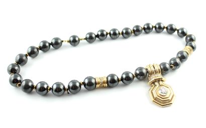 Collier en or jaune 18K (750/1000) composé...
