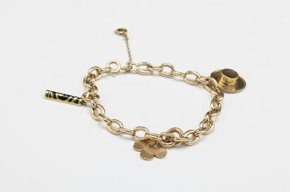 Forçat link bracelet holding three charms...