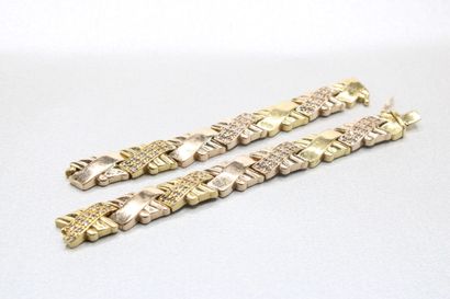 Two 14K (585/1000) gold articulated bracelet,...