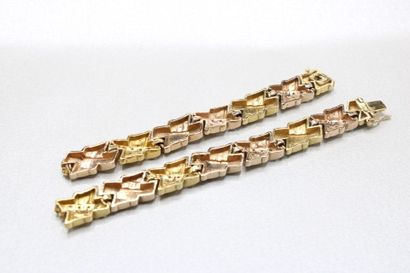 Two 14K (585/1000) gold articulated bracelet,...