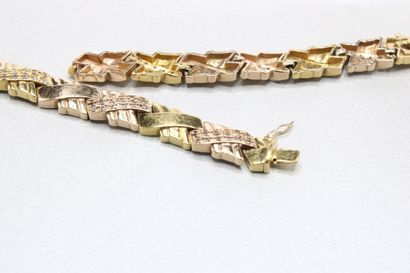 Two 14K (585/1000) gold articulated bracelet,...