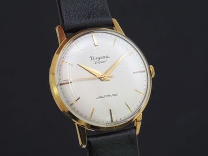 DUGENA
Montre de poignet plaqué or. Boitier...