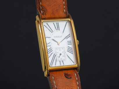 TISSOT
Montre de poignet plaquée or. Boitier...