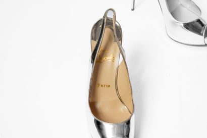 LOUBOUTIN
Silver platform with red sole 
Size:...