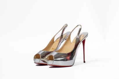 LOUBOUTIN
Silver platform with red sole 
Size:...