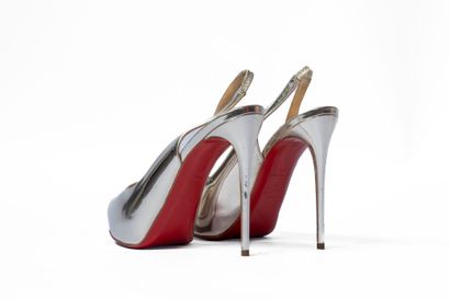 LOUBOUTIN
Silver platform with red sole 
Size:...