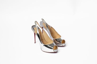 LOUBOUTIN
Silver platform with red sole 
Size:...