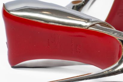 LOUBOUTIN
Silver platform with red sole 
Size:...