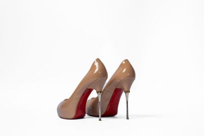 LOUBOUTIN
Cream platform with metal heel,...