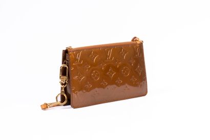 LOUIS VUITTON
Embossed leather accessory...