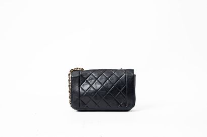 CHANEL 
Diana bag in black quilted lambskin...