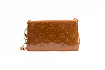 LOUIS VUITTON
Embossed leather accessory...